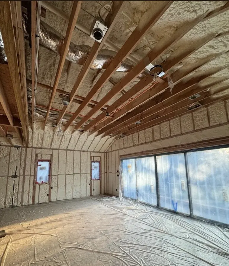 Interior walls and ceiling insulated with spray foam during new construction in Northgate